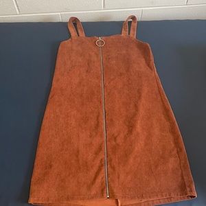 Popular Basics size L. It is a straight fit dress, but it hugs curves perfectly.